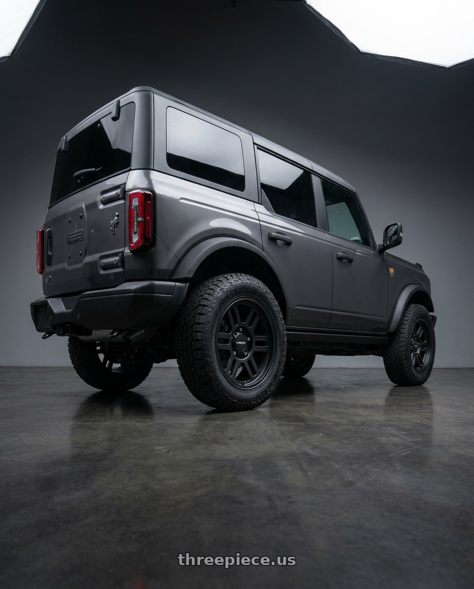 2023 Ford Bronco with Vision Off-Road 355 Manx 2 Overland 6x139.7 17x9+18 Satin Black wheels rear three quarter view square tires