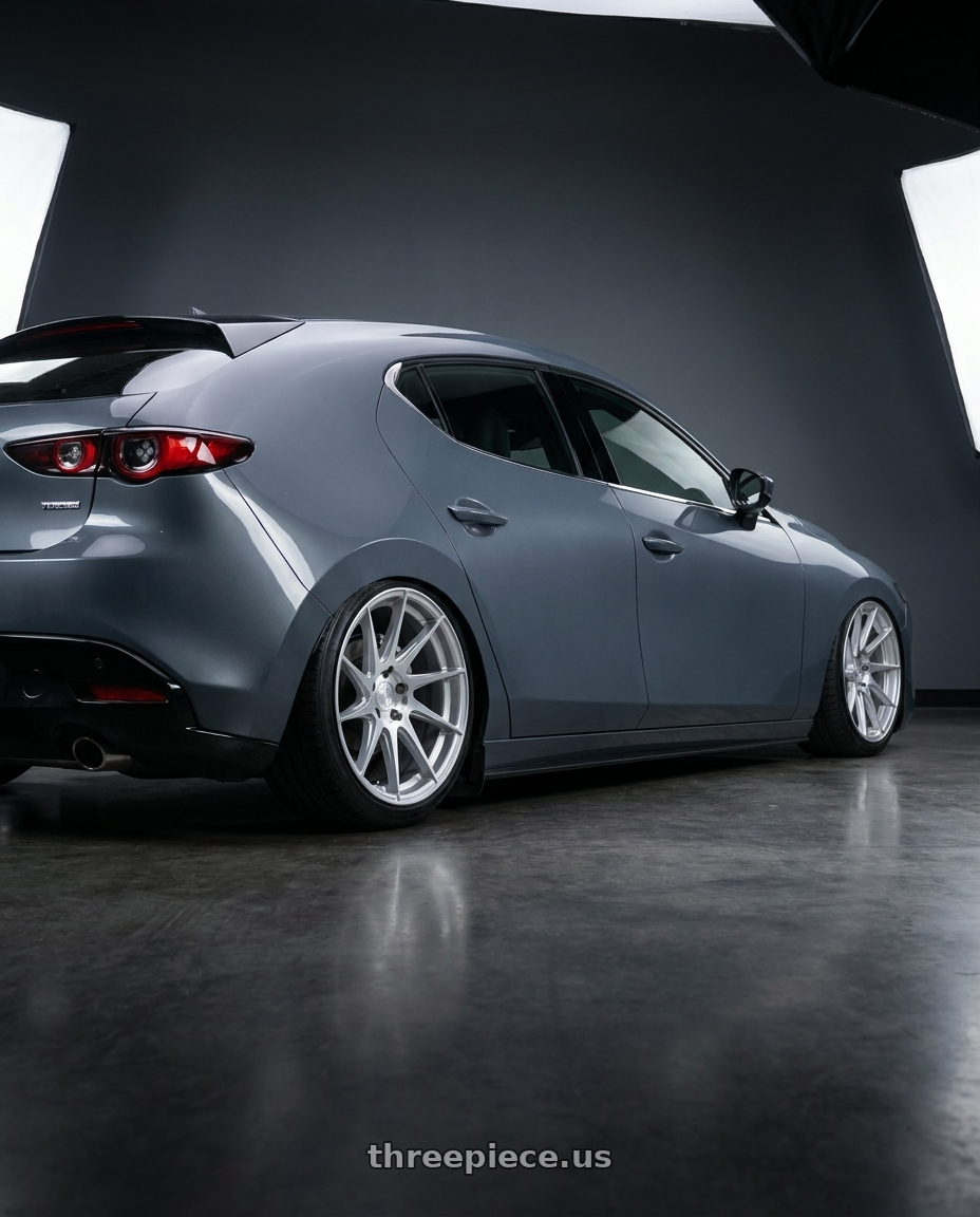 2023 Mazda Mazda3 Turbo with Aodhan AH09 5x114.3 18x8.5 +35 Gloss Silver Machined Face wheels rear three quarter view slight stretch tires