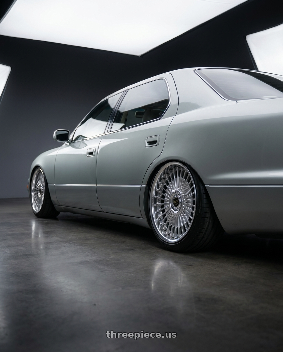 1998 LEXUS LS400 with Work Emitz wheels rear three quarter view slight stretch tires