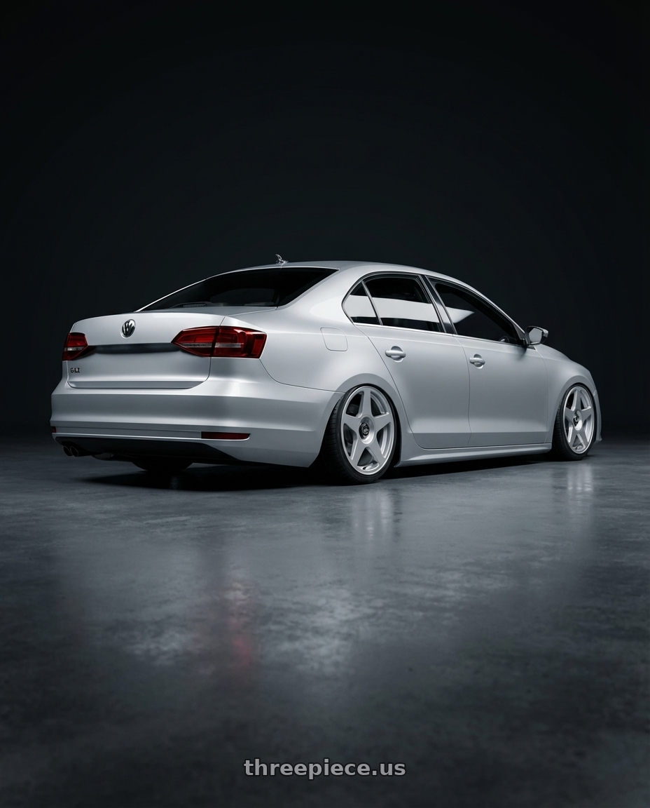 2016 Volkswagen Jetta GLI MK6 with fifteen52 TARMAC EVO 5x112 / 5x120 18x8.5 +35 SPEED SILVER (GLOSS SILVER) wheels rear three quarter view slight stretch tires