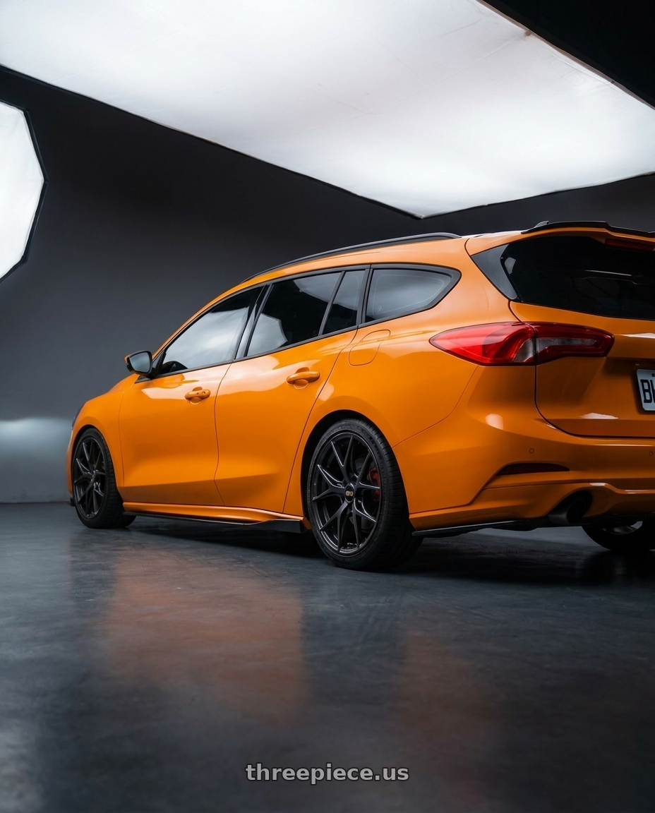 2021 ford focus wagon st  with BBS RE-V7 5x112 19x8.5 +43 Diamond Black wheels rear three quarter view slight stretch tires