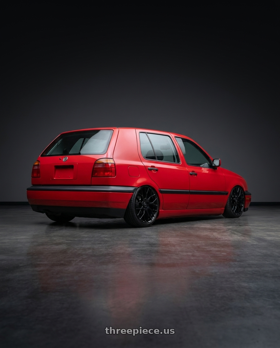 1993 Volkswagen Golf with Petrol P2B 4x100 16x7 +40 GLOSS BLACK wheels rear three quarter view slight stretch tires