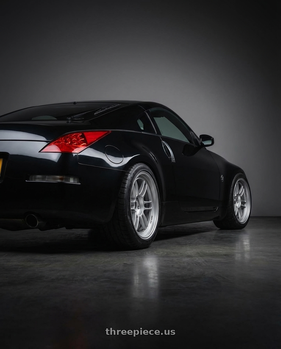 2009 nissan 350z with Enkei RPF1 5x112 18x8+35 Silver wheels rear three quarter view meaty tires
