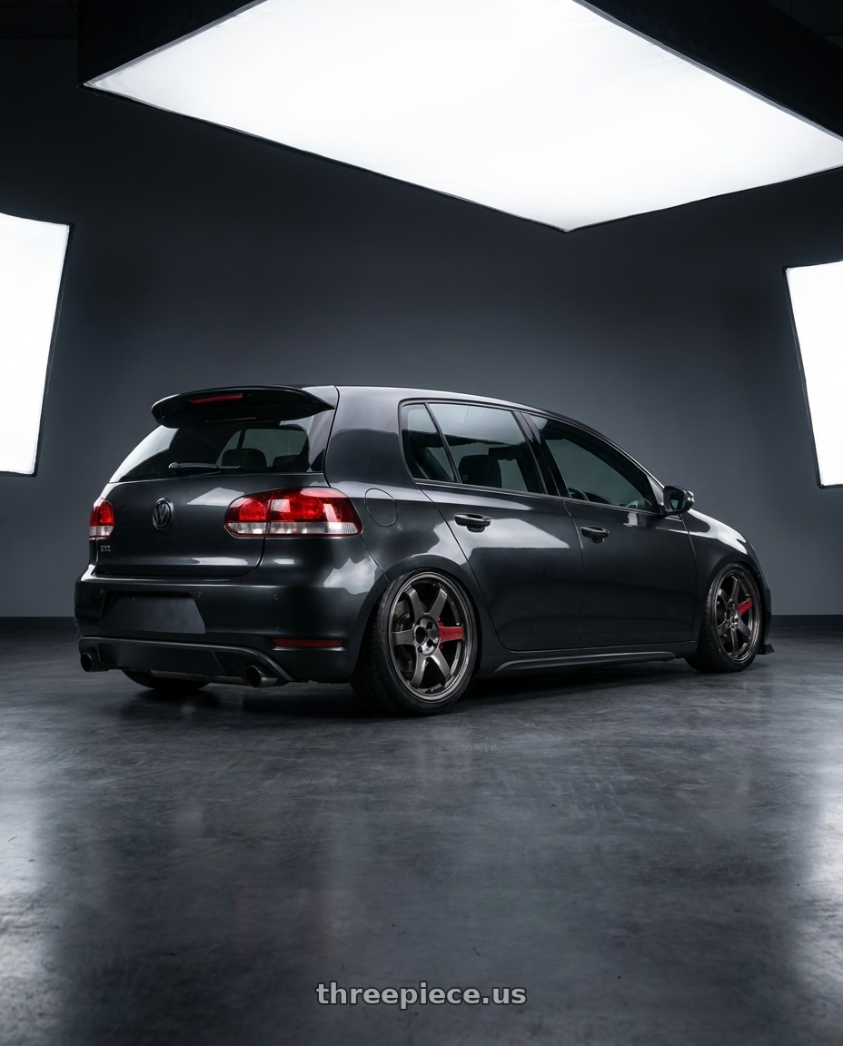 2010 golf gti with Volk Racing TE37 Saga SL 5x114.3 18x8.5+45 Pressed Graphite wheels rear three quarter view slight stretch tires