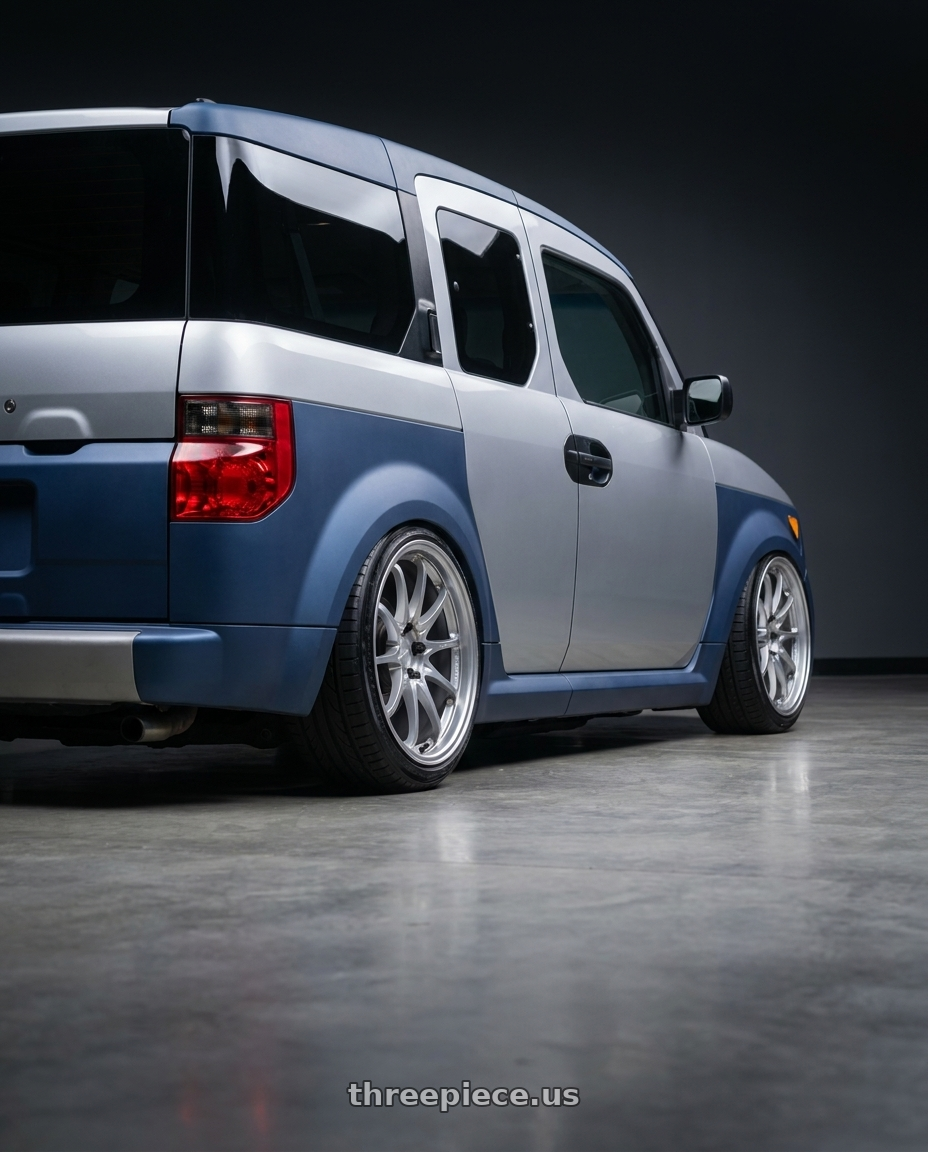 2006 Honda Element with Volk Racing CE28N-PLUS M-SPEC 5x114.3 18x9.5+22 Diamond Silver wheels rear three quarter view extreme stretch tires
