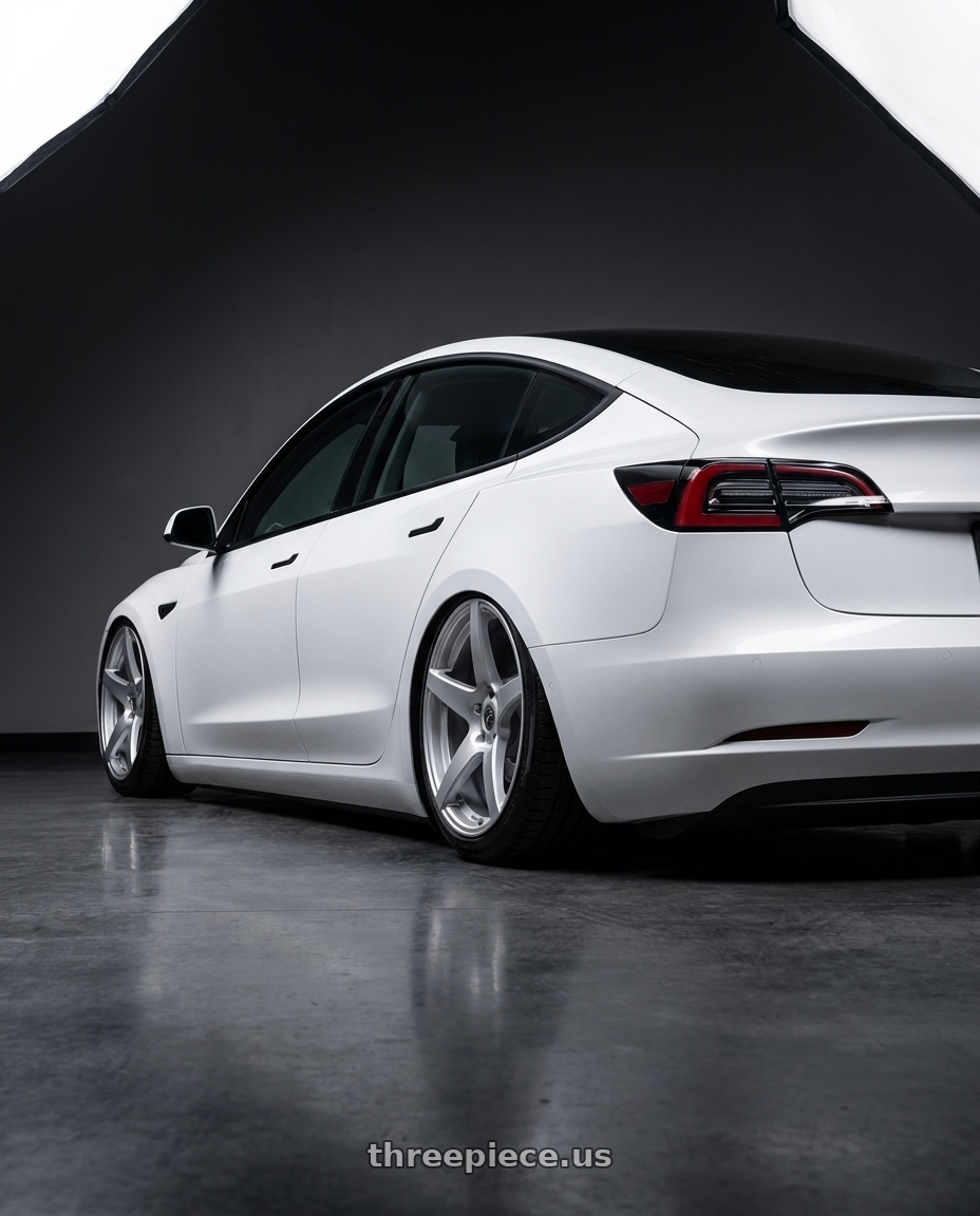2023 Tesla Model 3 with Forgestar CF5 5x114.3 19x9 +35 Gloss Silver wheels rear three quarter view slight stretch tires