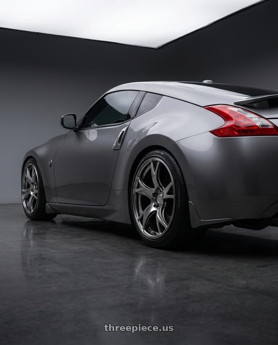 2009 Nissan 370z with Advan RGIII 5x114.3 18x10.5+15 Hyper Black wheels rear three quarter view square tires