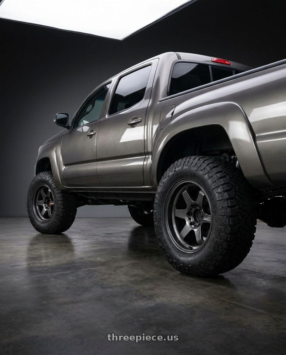 2015 Toyota Tacoma with Advan Racing GT HEAVY DUTY 6x139.7 17x8.5 +x10 RACING TITANIUM BLACK wheels rear three quarter view meaty tires