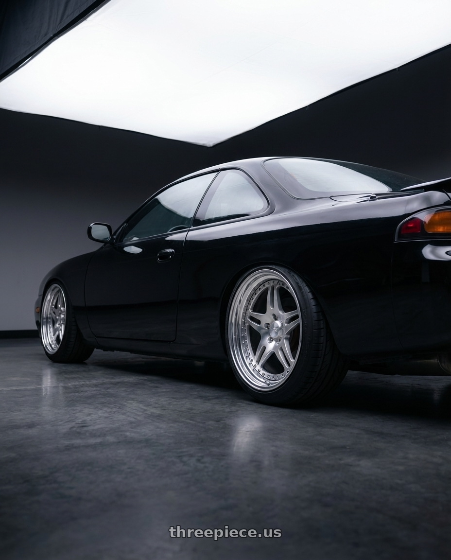 1997 nissan 240sx  with CCW SA52 4x100 16x7 +22 Polished wheels rear three quarter view square tires