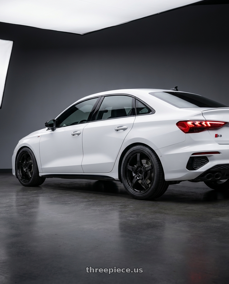 2024 Audi S3 8Y with Gram Lights 57CR 5x112 19x9.5+25 Glossy Black wheels rear three quarter view square tires