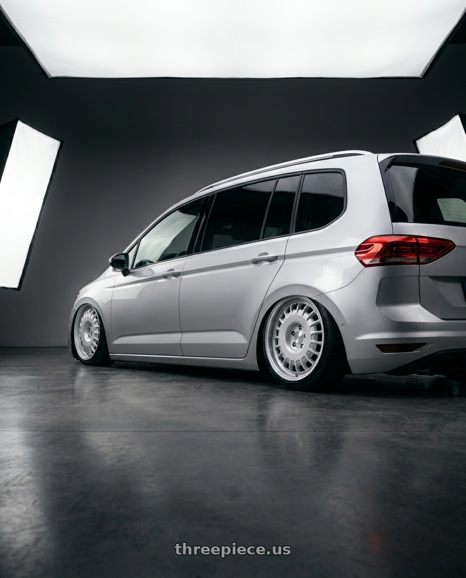 2017 Vw touran with Rotiform RC205 PMF 5X112 18x8.5 +45 GLOSS SILVER wheels rear three quarter view slight stretch tires