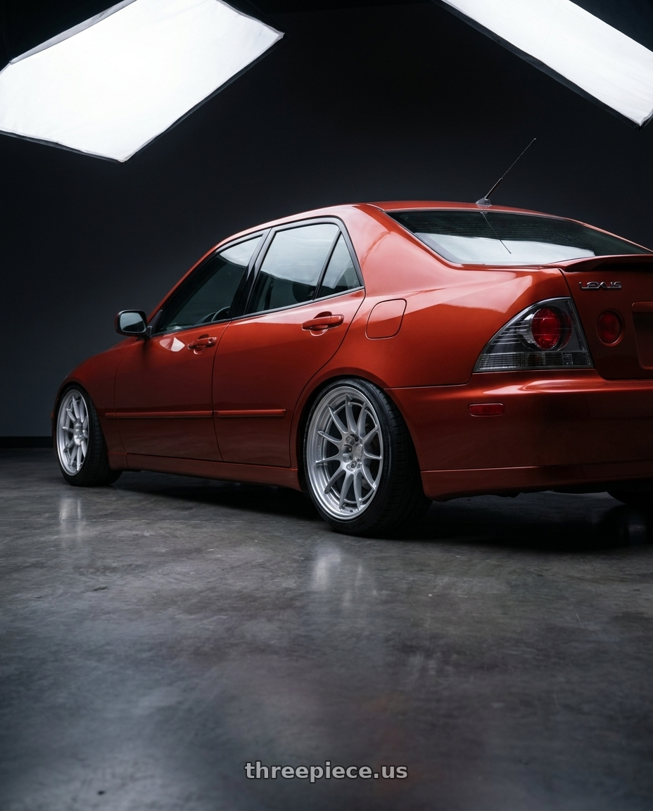 2001 Lexus IS300 Auburn Sky with Enkei NT03+M 5x108 18x9.5+40 Hyper Silver wheels rear three quarter view slight stretch tires