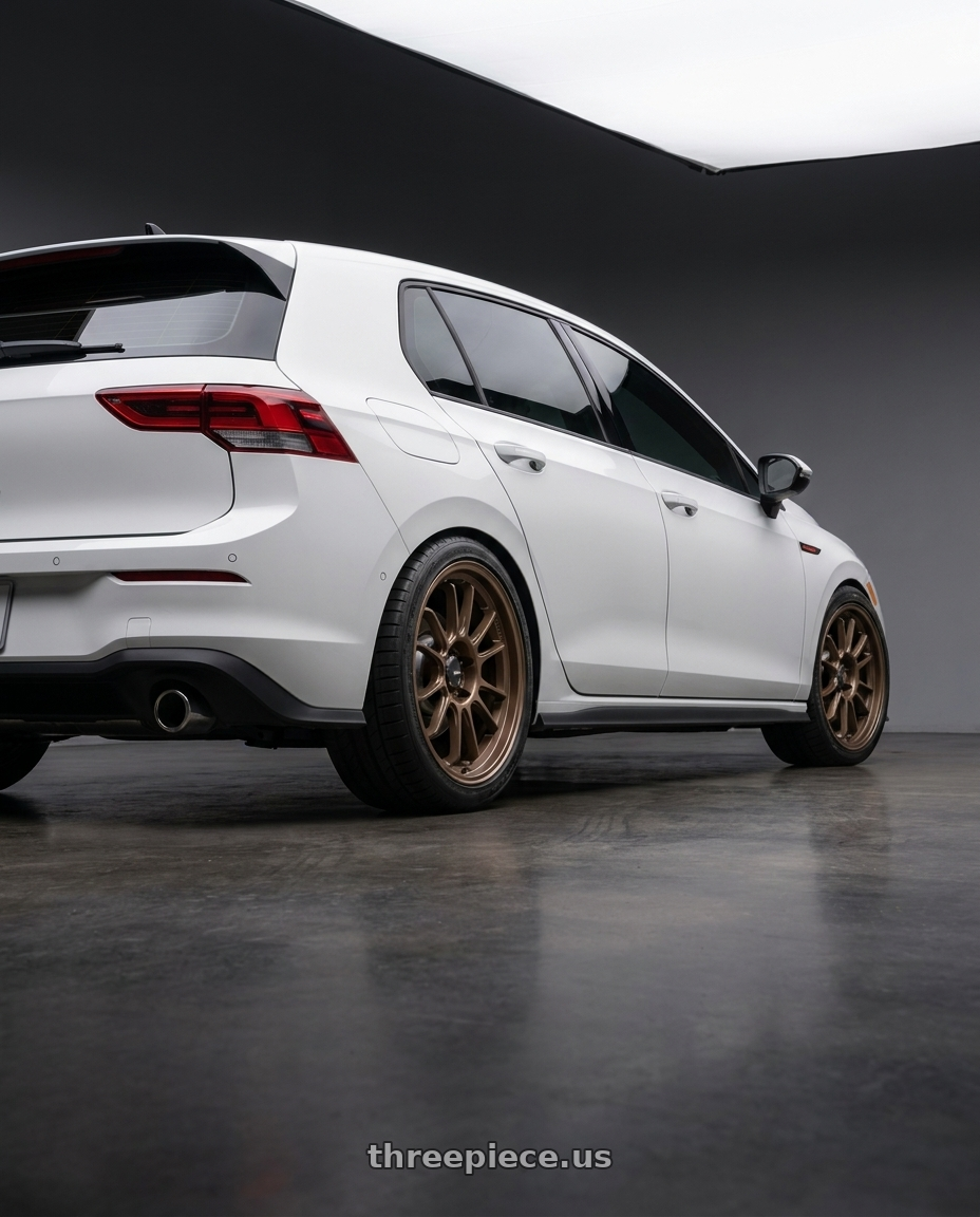 2025 Volkswagen gti with Konig Hypergram 5x112 18x8.5+43 Race Bronze wheels rear three quarter view square tires
