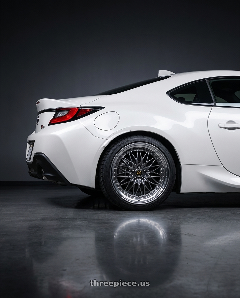 2023 GR86 white with Work Vs-Xv 5x100 18x7+28 A Disk Brilliant Silver Black wheels rear three quarter view square tires