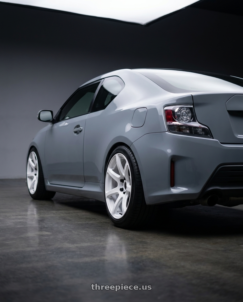 2016 toyota scion Tc with Work Emotion T7r 5x114.3 18x7.5 +47 White wheels rear three quarter view meaty tires