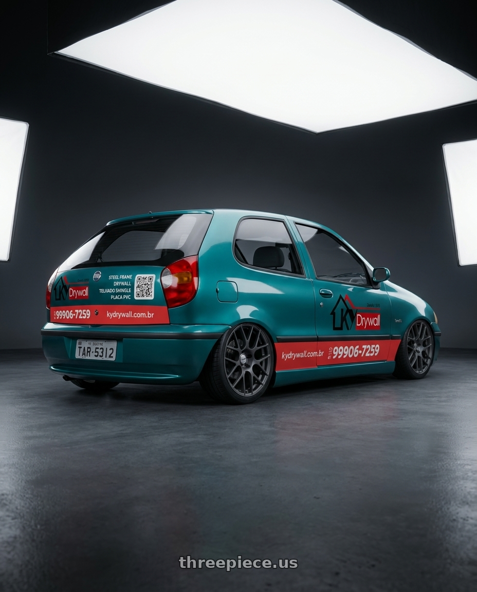 1997 fiat palio adesivado with TSW NURBURGRING 5X114.3 17X7.5 +45 MATTE GUNMETAL wheels rear three quarter view square tires