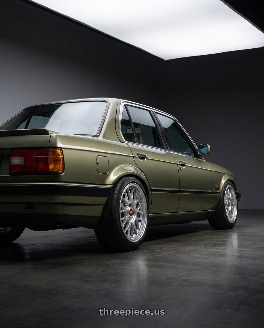 1987 e30 early model with BBS RG-F 4x100 15x7 +33 Sport Silver wheels rear three quarter view slight stretch tires