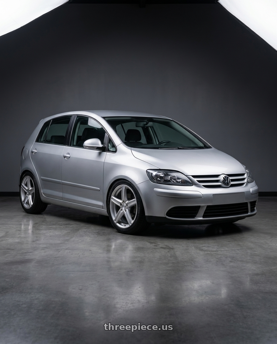 2006 Volkswagen Golf with Vision Street-Designs 469 Boost 5x112 17x7+42 Silver wheels front three quarter view lowered stance