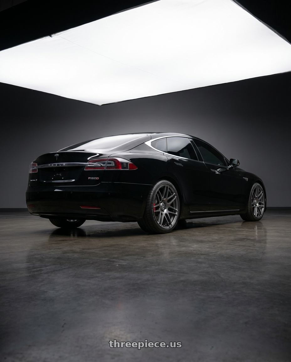 2018 model s p100d with Forgestar F14 5x120 20x9 +35 Gloss Anthracite wheels rear three quarter view square tires