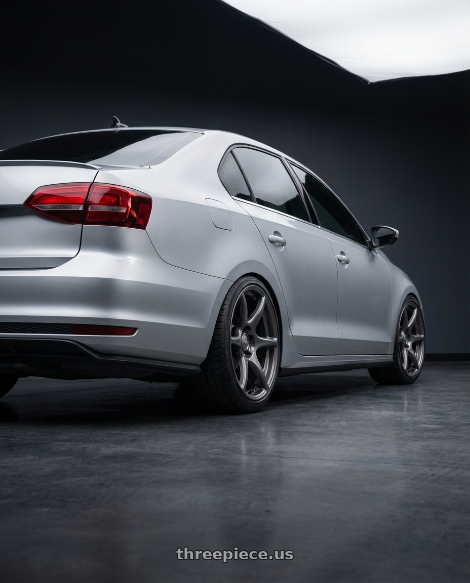 2016 Volkswagen Jetta GLI MK6 with Kansei K11G Tandem 5X112 18x8.5 35 Gunmetal wheels rear three quarter view square tires