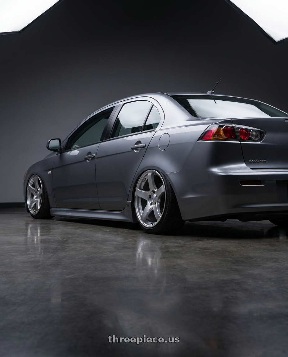 2014 Mitsubishi Lancer Ralliart with Ssr Gtv01 5x114.3 18x9+35  GLARE SILVER wheels rear three quarter view slight stretch tires