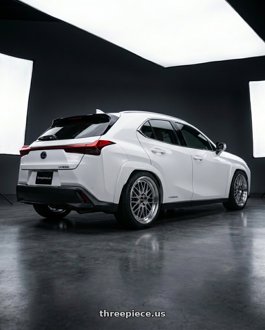 2026 Lexus UX300h with BBS LM 5x114.3 19x9.0+38 Diamond Silver wheels rear three quarter view square tires