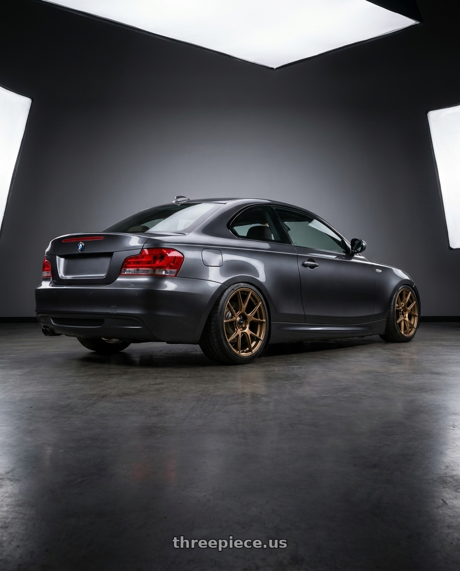 2012 BMW 1 Series E82 with Konig Ampliform 5x120 19x10+28 Gloss Bronze wheels rear three quarter view slight stretch tires
