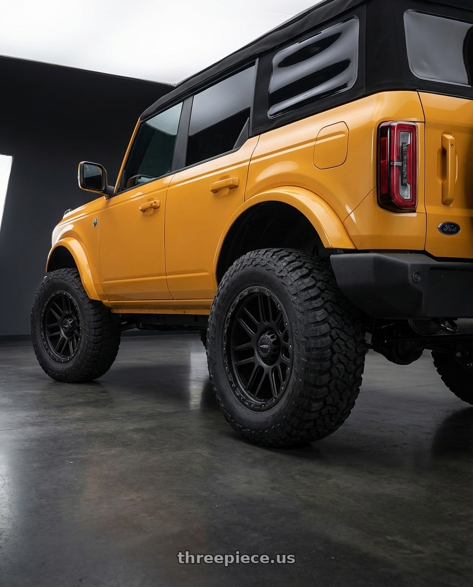 2024 Ford Bronco with Vision Off-Road 111 Nemesis 6x139.7 20x9+0 Matte Black wheels rear three quarter view meaty tires