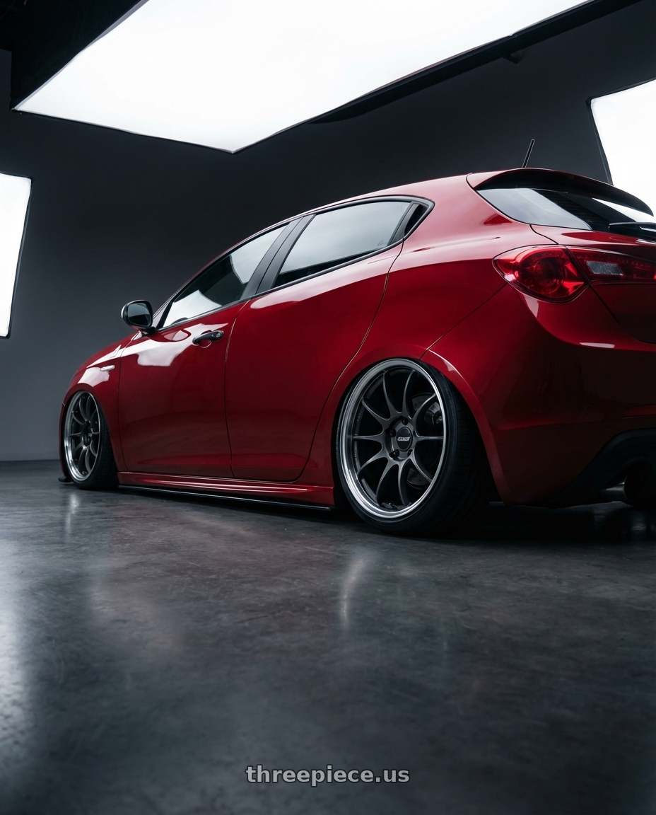 2012 Alfa Romeo Giulietta QV 940 with Volk Racing G025 5x120 19x9.5 +25 MATTE GUNBLACK / DC wheels rear three quarter view slight stretch tires
