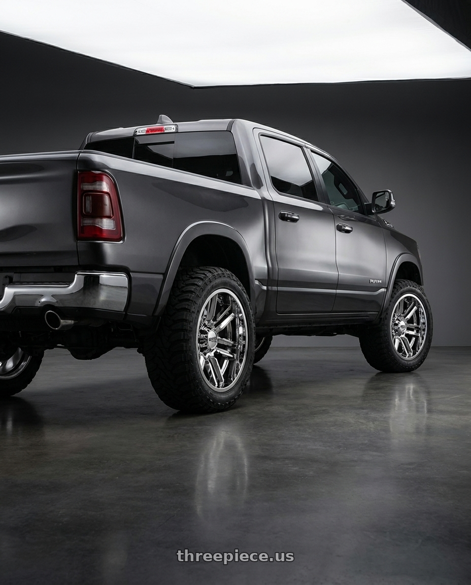 2024 Ram 1500 with Moto Metal MO202 6X139.7 22X10 -18 CHROME CENTER GLOSS BLACK MILLED LIP wheels rear three quarter view meaty tires