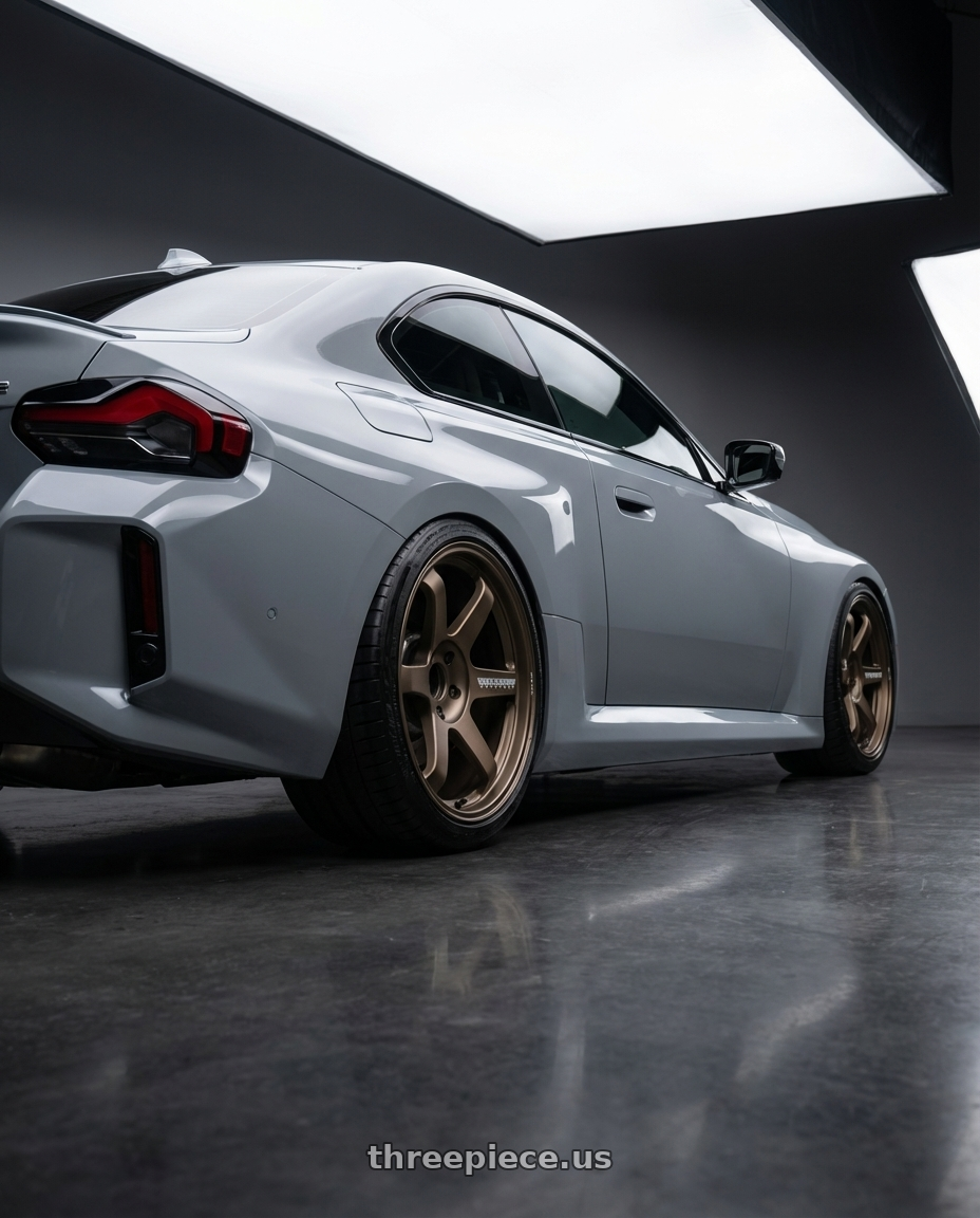 2025 bmw m2 with Volk Racing TE37 Ultra M Spec 5x112 19x9.5+23 19x10.5+35 Bronze Almite Toyota Supra MK5 Spec wheels rear three quarter view square tires