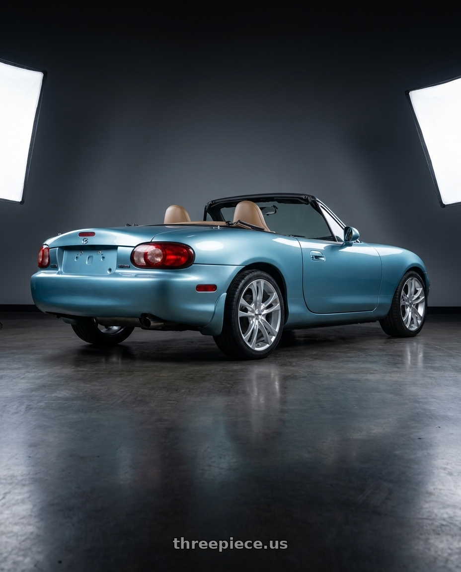 2002 Mazda Miata with TOUREN TR22 3222 4x100/4x114.3 14x6 +40 GLOSS HYPER SILVER wheels rear three quarter view square tires