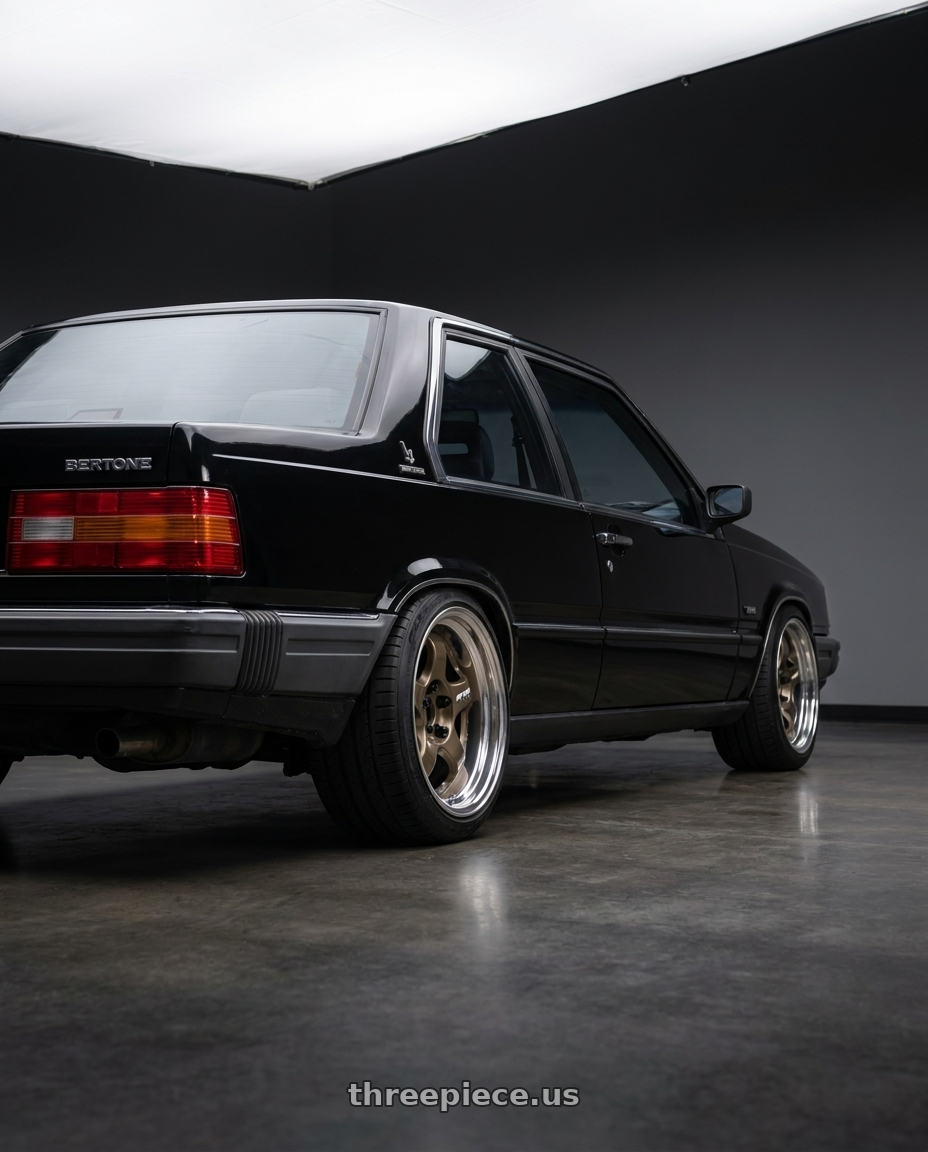 1990 Volvo 780 bertone with Work Meister S1 2P 5x108 15x7+12 O Disk Titanium Gold wheels rear three quarter view square tires