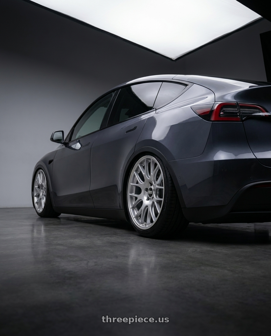 2025 Tesla model y with BBS CH-R 5x130 19x8.5 +51 Brilliant Silver Polished Rim Protector wheels rear three quarter view slight stretch tires