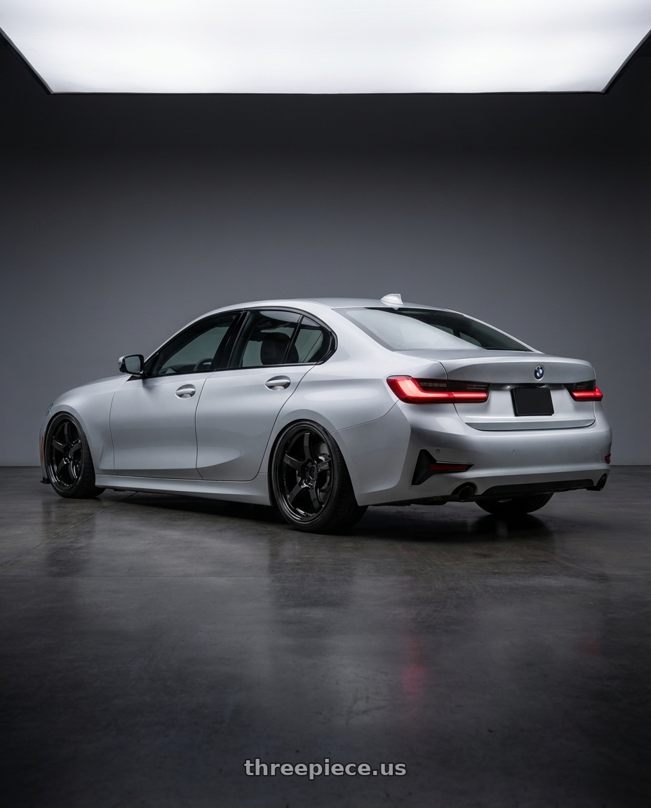 2023 BMW 3 Series G20 with Gram Lights 57CR 5x112 19x10.5+22 Glossy Black wheels rear three quarter view slight stretch tires