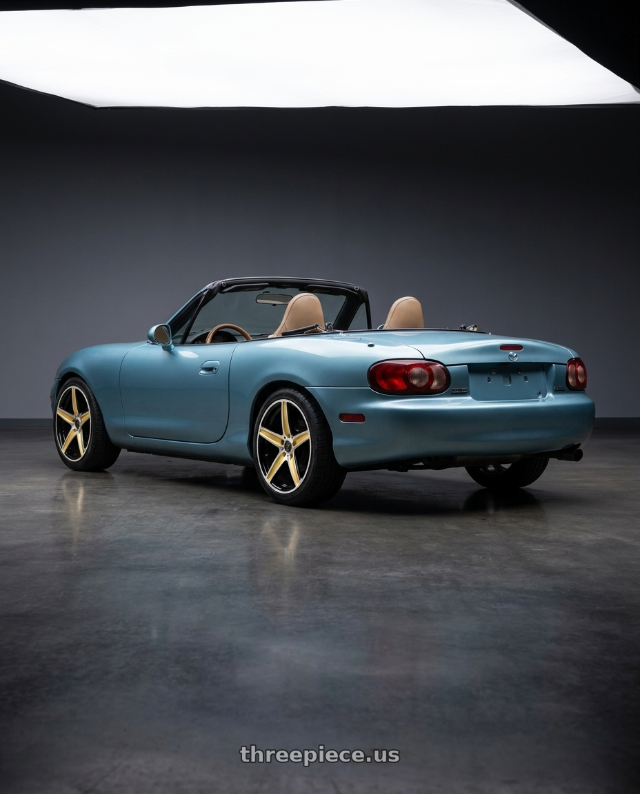 2002 Mazda Miata with WHITE DIAMOND W253 4x100/4x114.3 15x6+35 GOLD/BLACK wheels rear three quarter view square tires