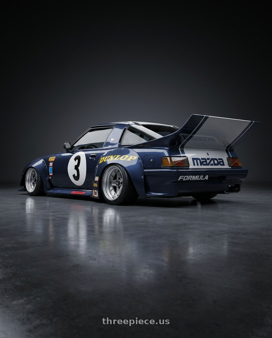 1983 Mazda rx7 with Work Equip 40 4x100 15x6 -3 a disk Brut Silver wheels rear three quarter view extreme stretch tires