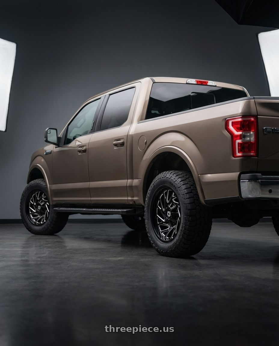 2019 Ford F-150 with Gear Off Road 769BM 6X135/6x139.7 20x9 +18 Gloss Black Milled wheels rear three quarter view meaty tires