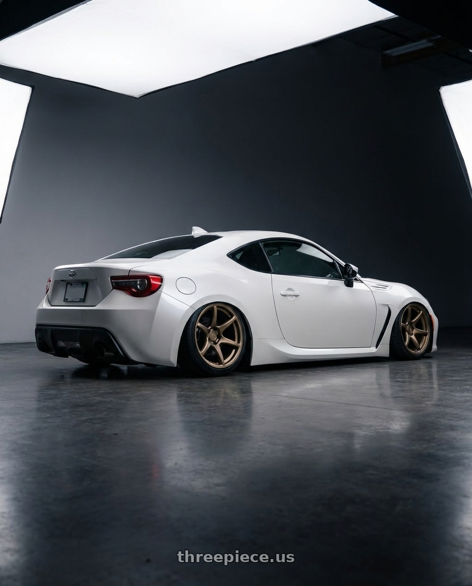 2016 Scion FR-S with Kansei K11B Tandem 5X100 18x8.5 35 Bronze wheels rear three quarter view slight stretch tires
