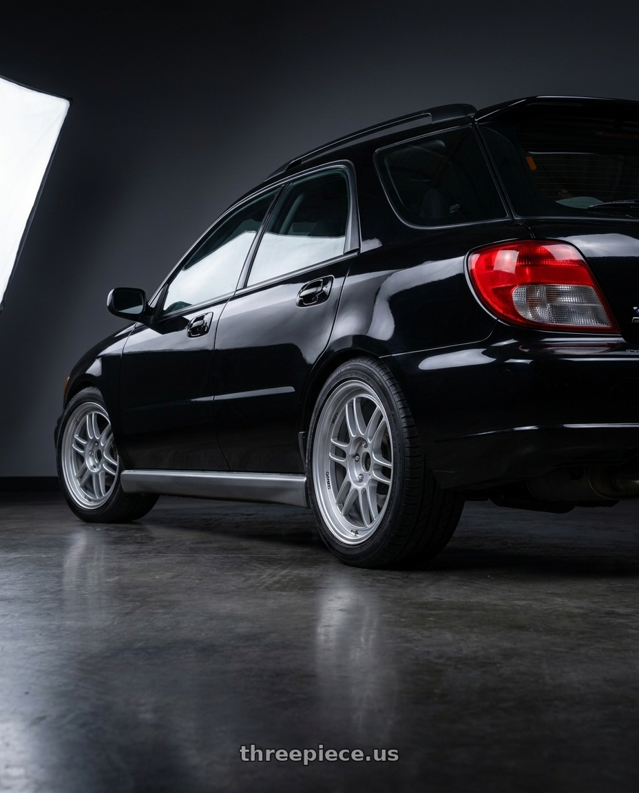 2002 Subaru Impreza WRX with Enkei RPF1 5x100 17x8+45 Silver wheels rear three quarter view square tires