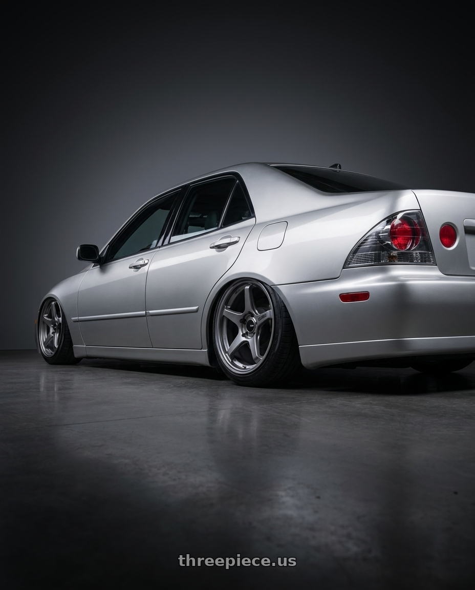 1999 Lexus is200 with Enkei TS-5 5x114.3 17x8+40 Storm Grey wheels rear three quarter view slight stretch tires