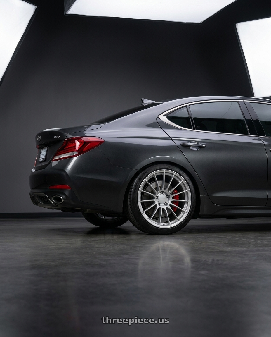 2019 Genesis G70 with Enkei RS05-RR 5x114.3 18x11+16 Sparkle Silver wheels rear three quarter view slight stretch tires