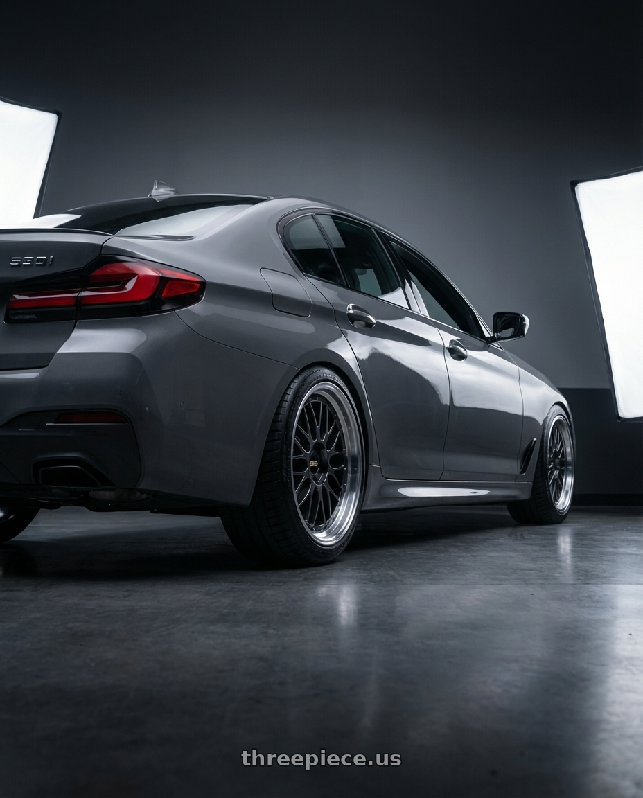 2022 bmw 530i with BBS LM 5x112 20x8.5+38 Diamond Black wheels rear three quarter view meaty tires