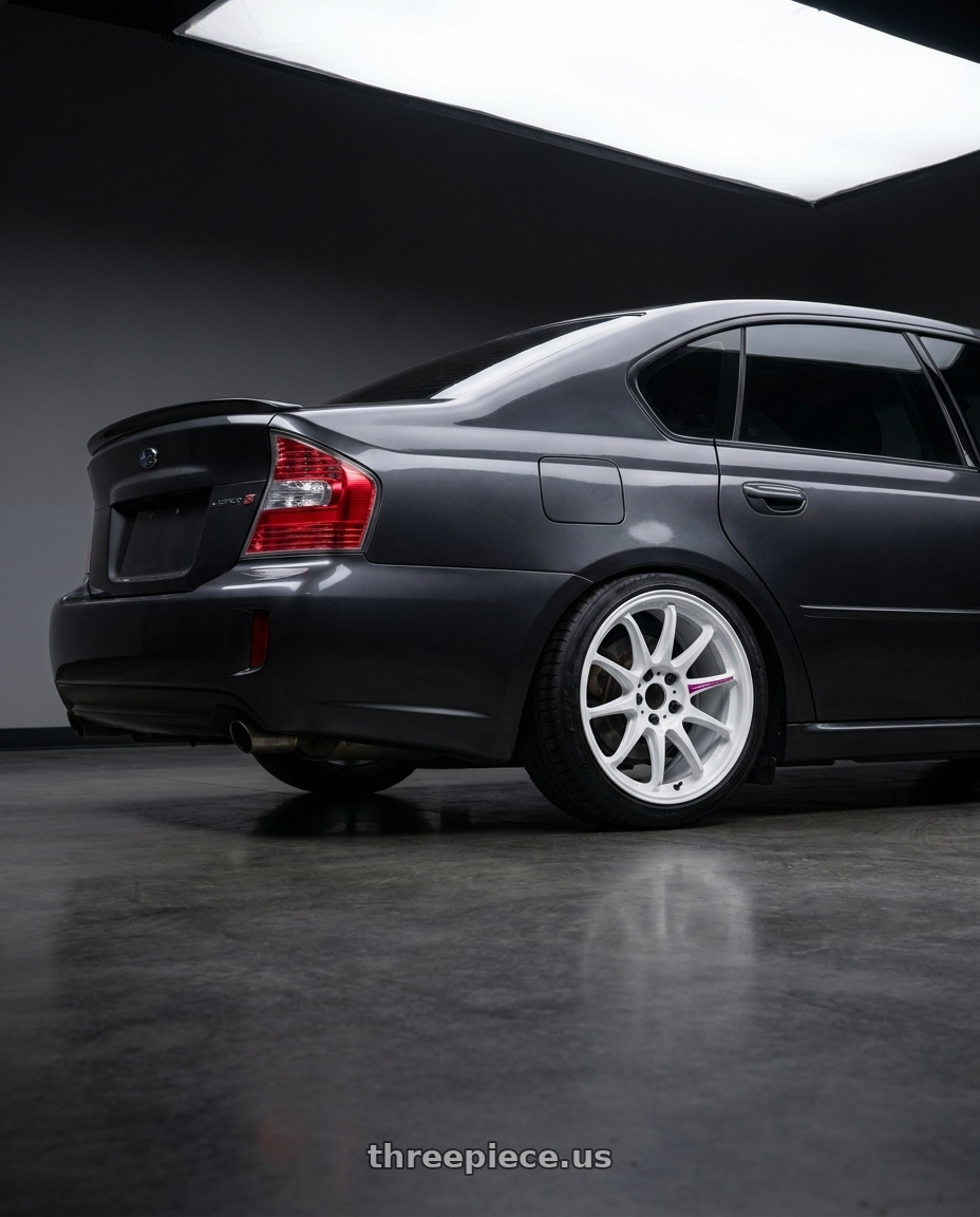 2007 Subaru Legacy Gt spec b  with Work Emotion Zr10 5x100 18x8.5 +38 Azure White wheels rear three quarter view slight stretch tires