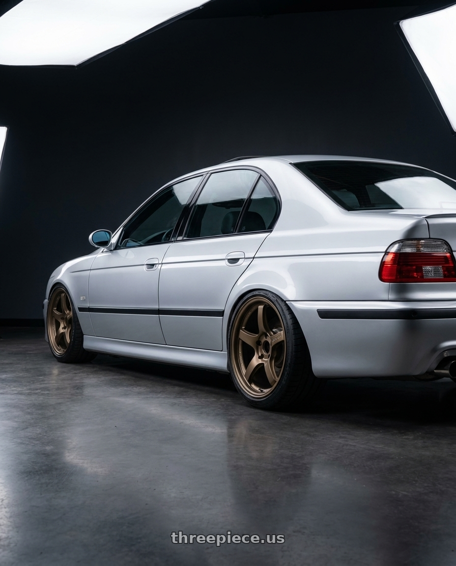 2000 bmw m5 with Gram Lights 57CR 5x114.3 18x9.5 +22 BRONZE 2 wheels rear three quarter view slight stretch tires