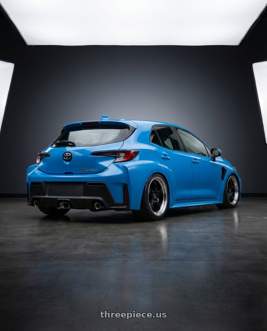 2024 Toyota GR Corolla with Forgestar D5 Drag 5x114.3 18x10 +22 Gloss Black Machined wheels rear three quarter view slight stretch tires