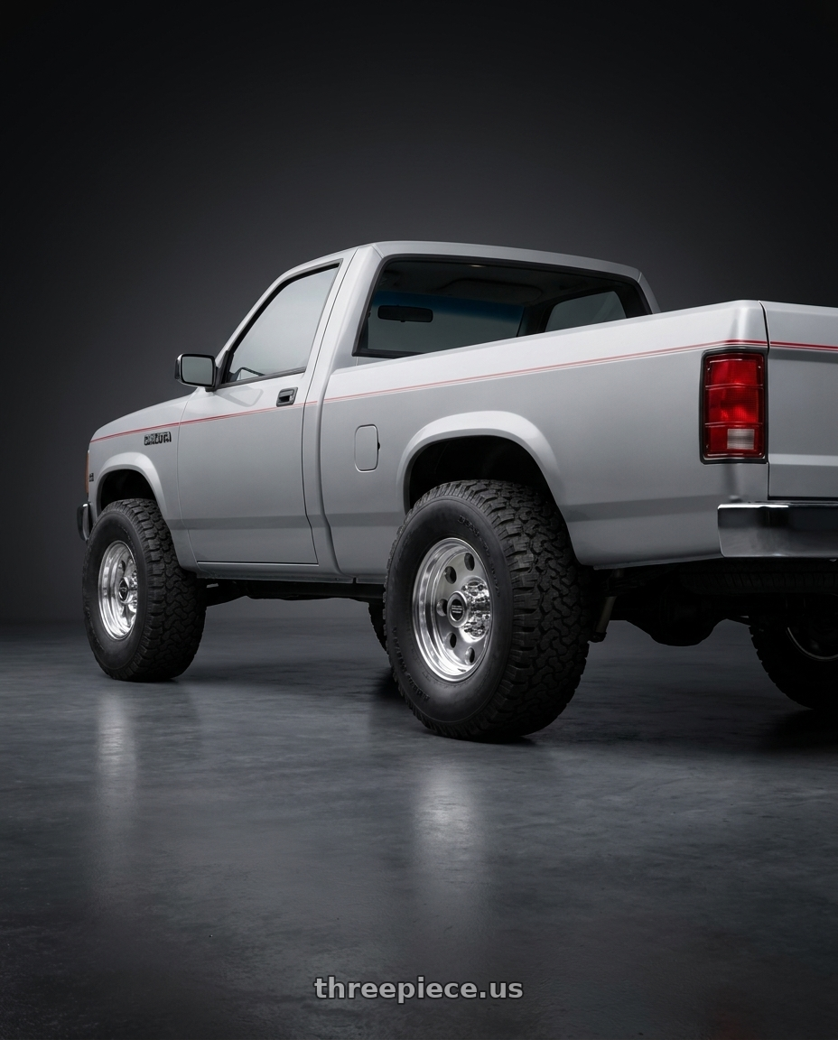 1990 dodge Dakota with American Racing AR172 BAJA 5X114.3 15X7 -6 POLISHED wheels rear three quarter view meaty tires