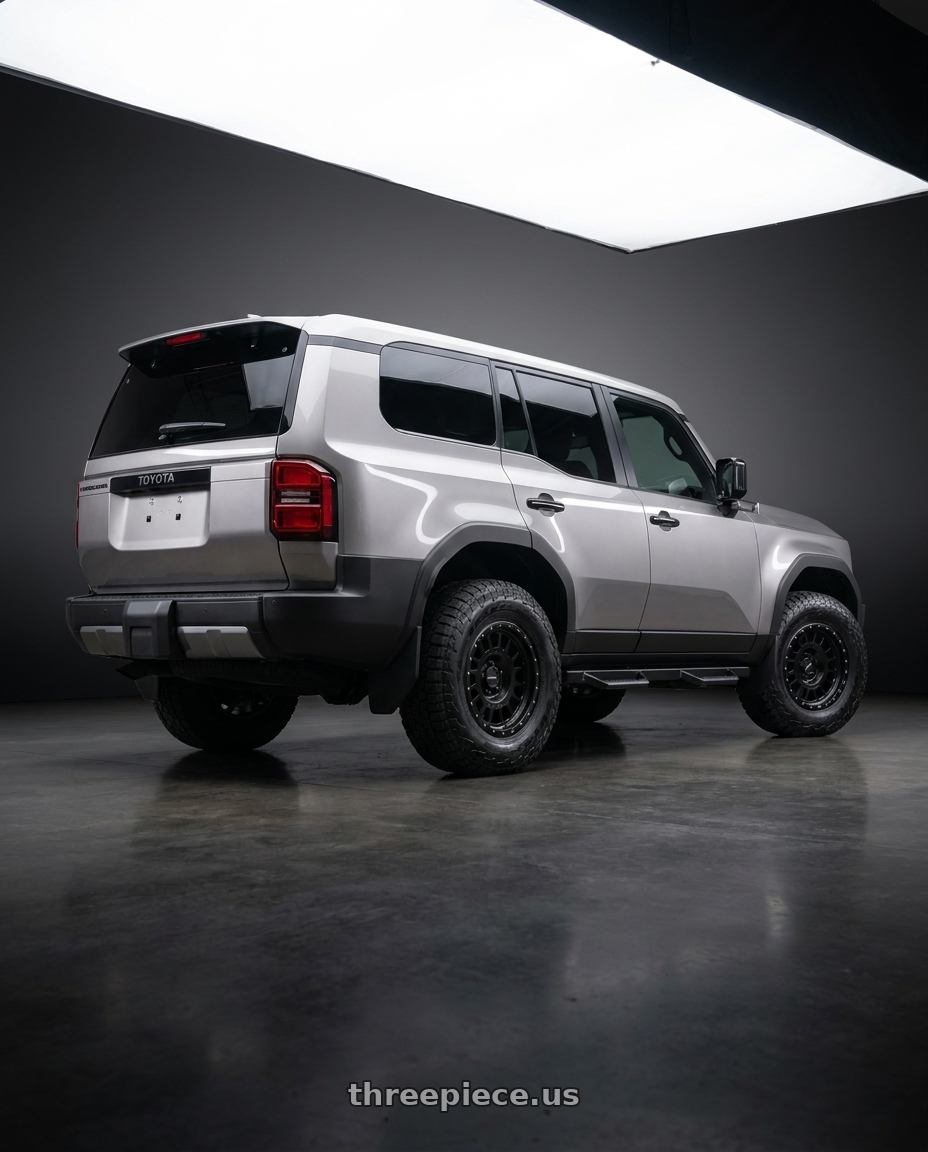 2024 toyota landcruiser with Method MR318 17x8.5 +25mm Offset 6x5.5 106.25mm CB Gloss Black - MR318785601325 wheels rear three quarter view square tires