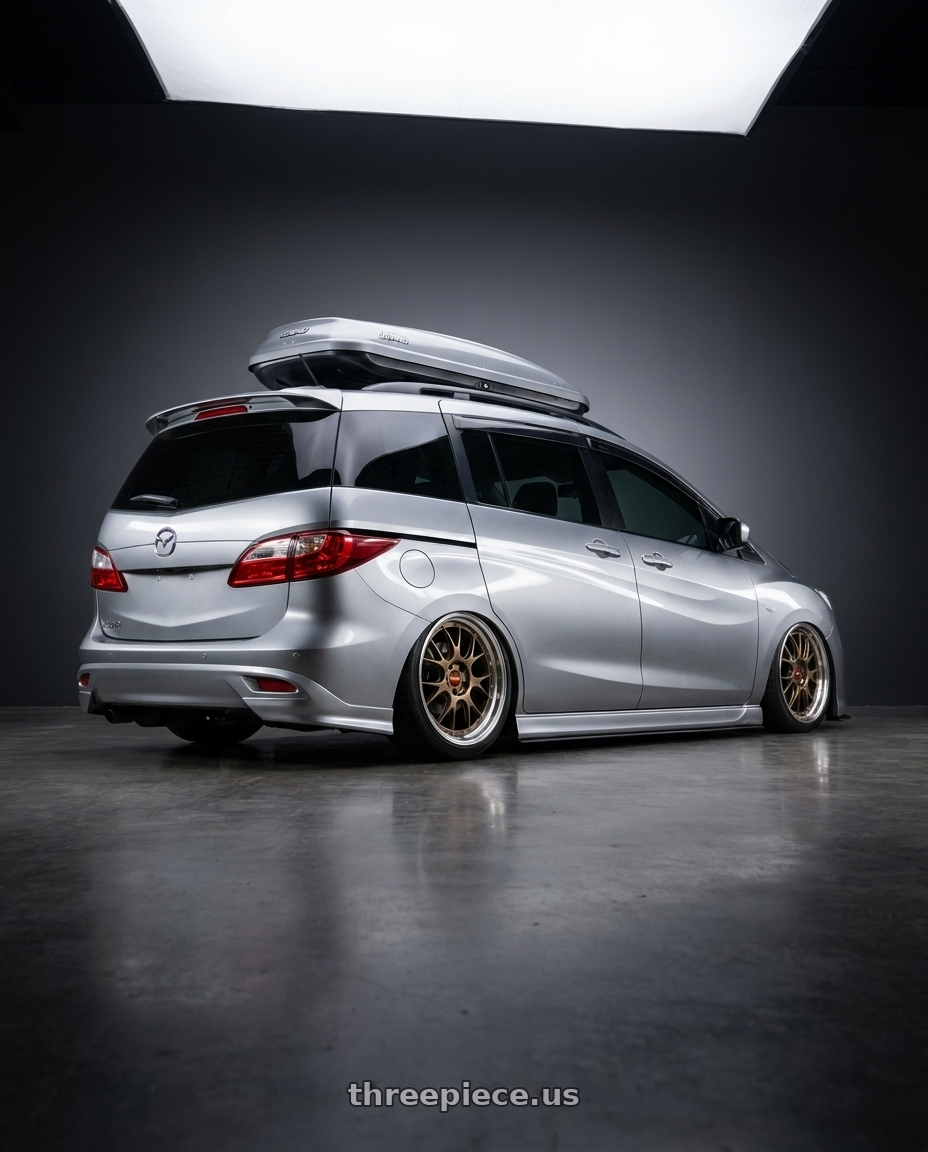 2012 Mazda 5 with BBS LM-R 5x120 20x9.5+23 Matte Bronze wheels rear three quarter view square tires