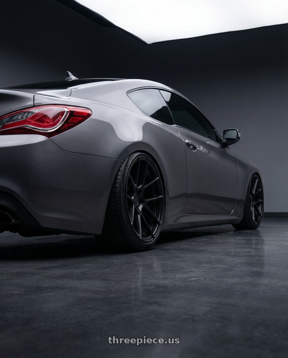 2014 Hyundai Genesis Coupe with Avant Garde Wheels M510 5X114.3 19x9.5 +40 Matte Black wheels rear three quarter view slight stretch tires